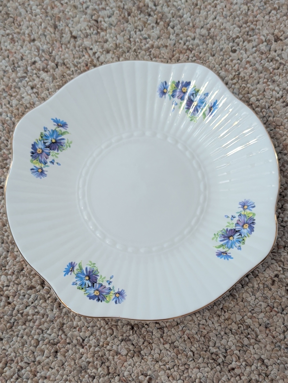 White Scalloped Porcelain Dinner Plate with Blue Floral Accents